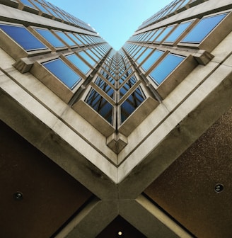 low angle view photography of brown high rise building