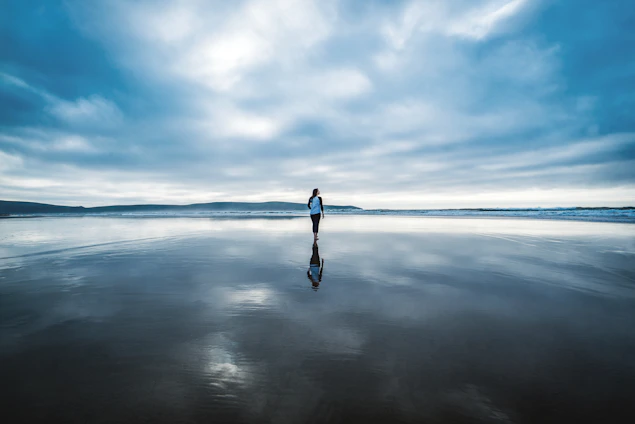 photography of person on body of water during daytime