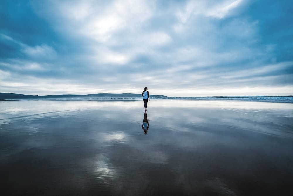 photography of person on body of water during daytime