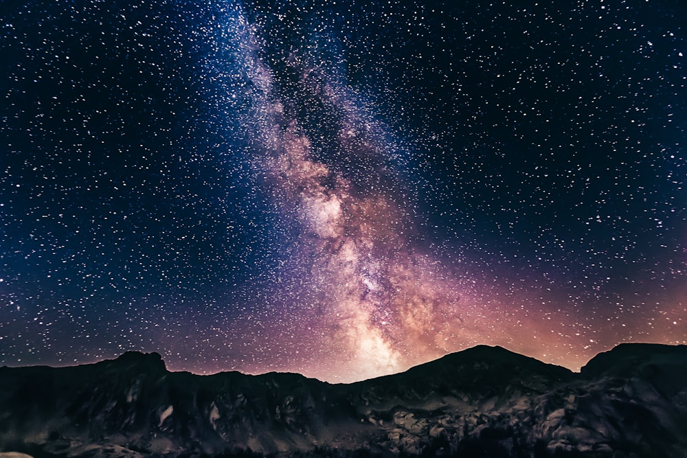milky way on mountains. Image on article talking about sleep restriction.