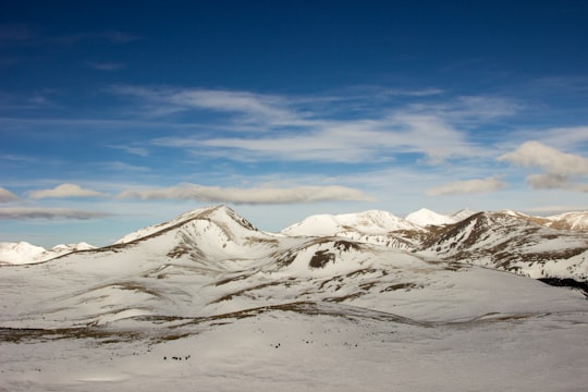 mountains covered with snows under white cloudy sky in Mount Bierstadt United States