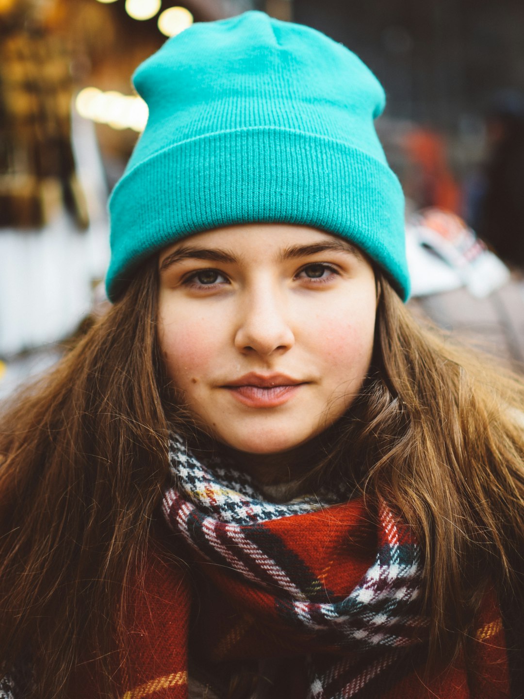 woman wearing scarf and knit cap