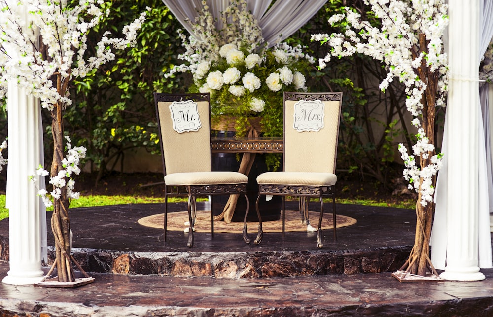 two black steel chairs beside table