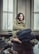 woman sitting near window