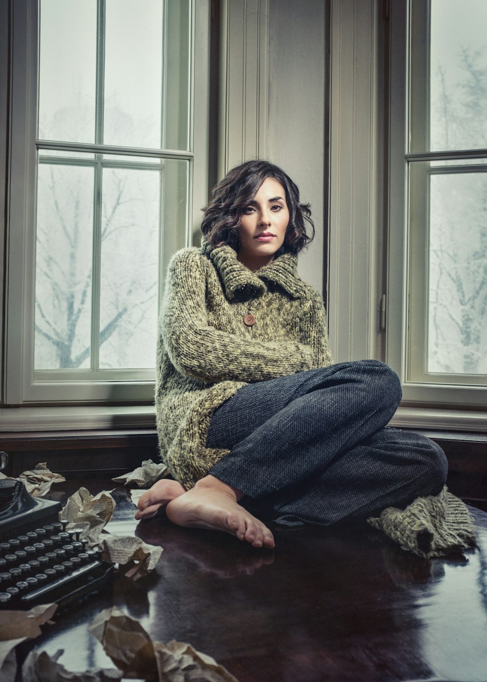 woman sitting near window