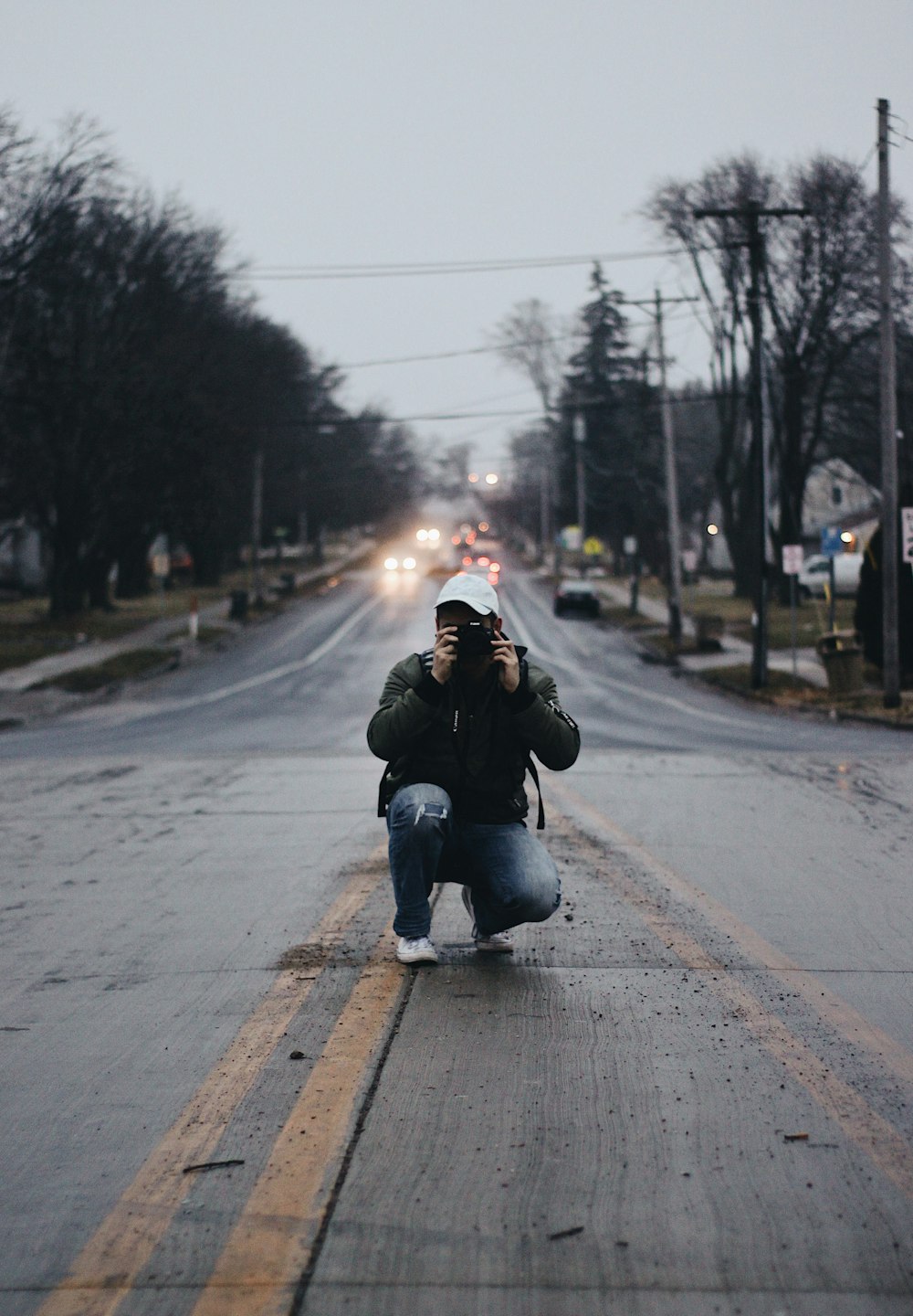 man taking photo on road