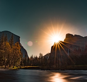 Sunset casting golden light over a quiet mountain river