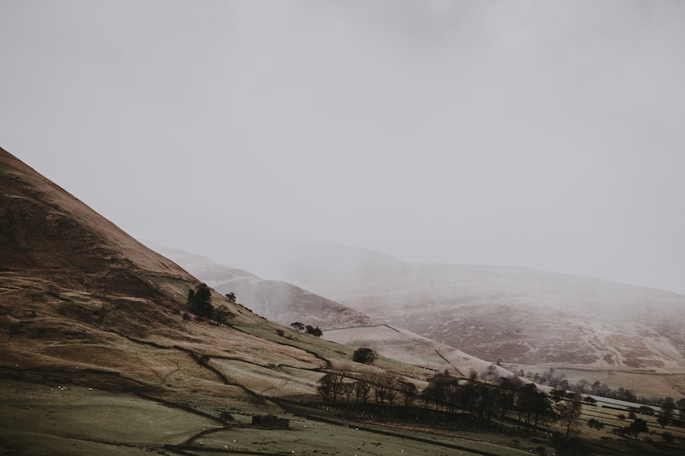 fog over brown mountains