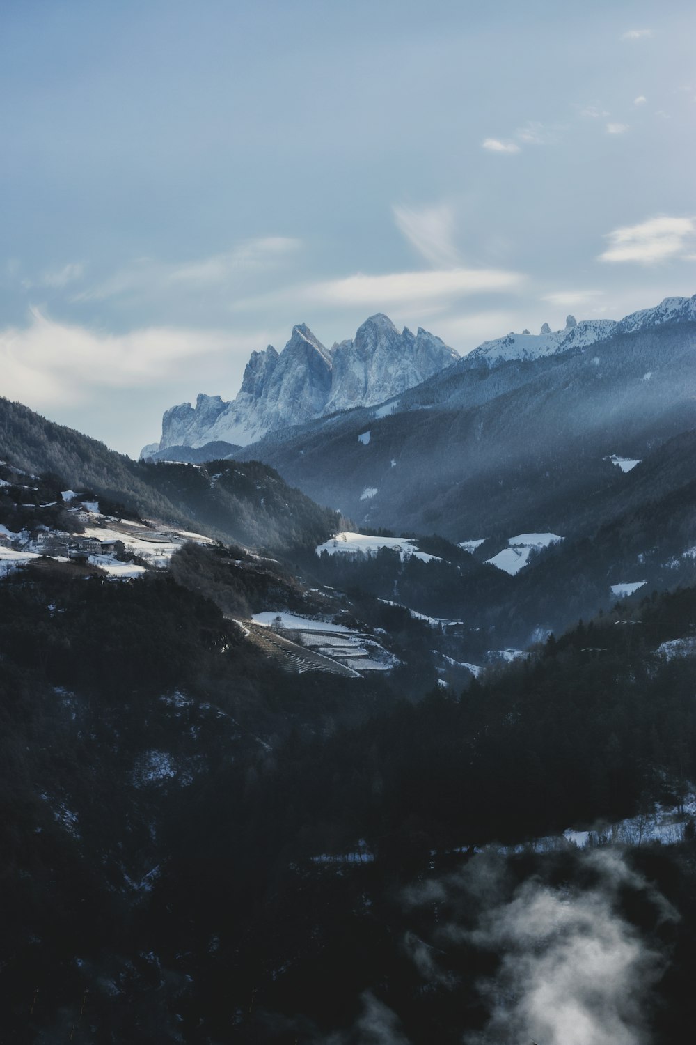 aerial photography snow covered mountains under blue sky at daytime