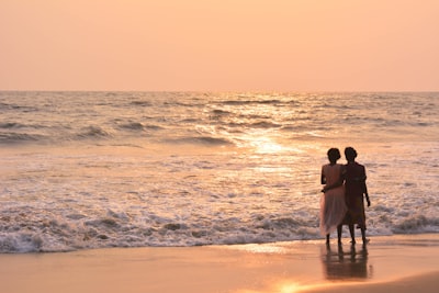 two women standing on shoreline patuxet indians google meet background