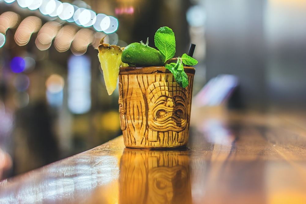 brown pot with green plant