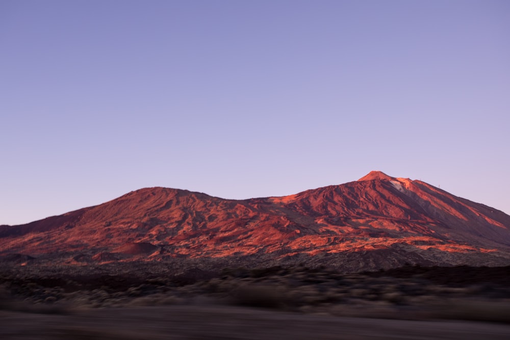 brown mountain under blue sky