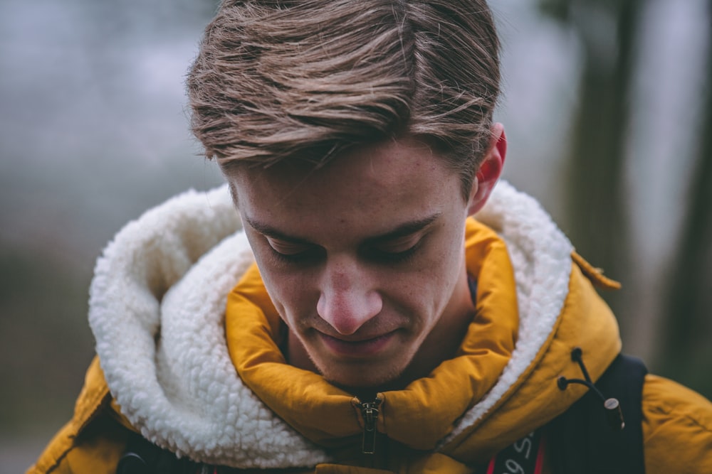 man wearing hoodie smiling