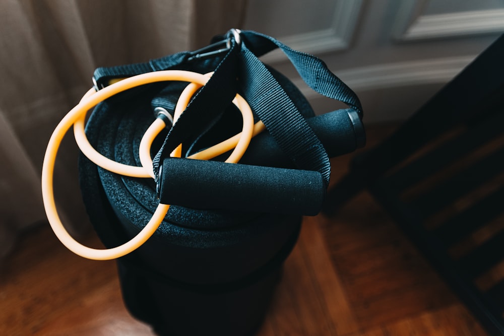 shallow focus photography of yellow and black stretch rope