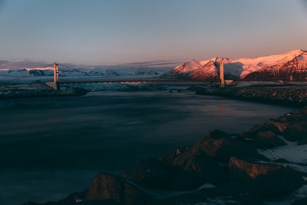 body of water surround by mountains