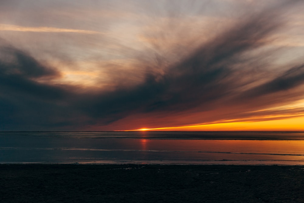 photo of beach during sunset