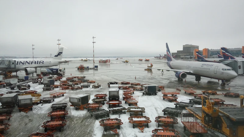 Aircraft and cargo trailers on an airport apron