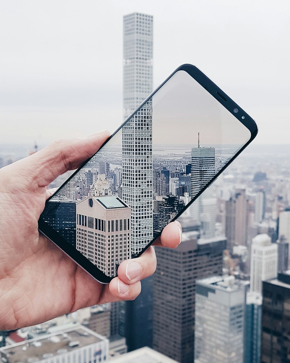 person holding black smartphone