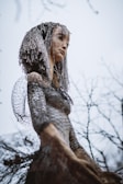A detailed sculpture made from mixed materials with organic shapes.