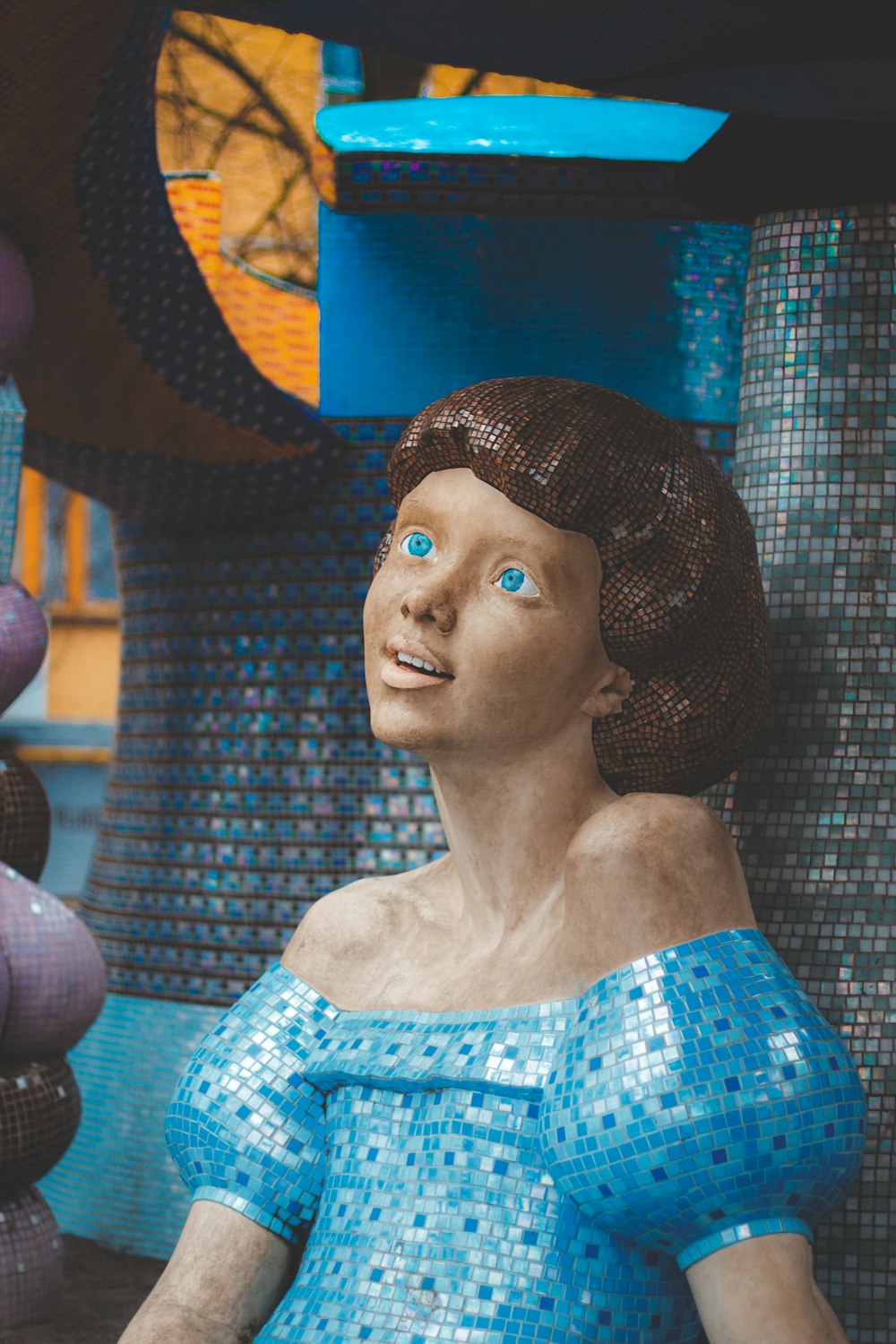 girl with blue off-shoulder dress statue