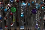 A whimsical hairstyle featuring colorful hairpins.