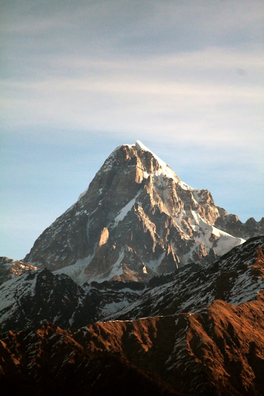 snow-capped mountain ranges under cloudy skies in Gangotri India