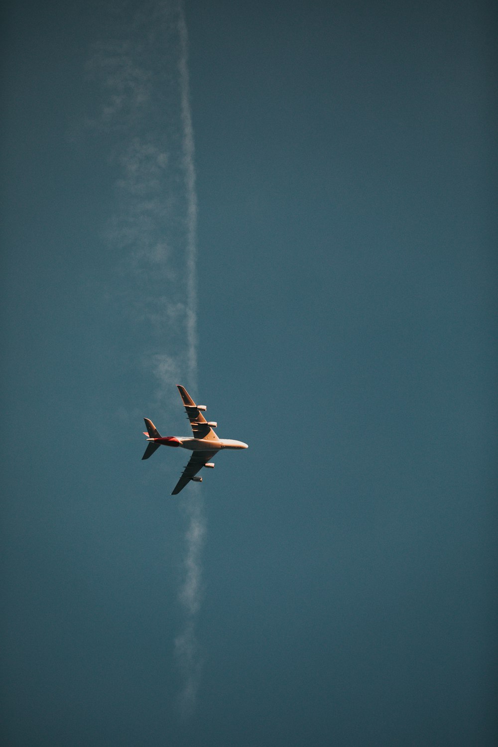 low-angle photo of white air plane