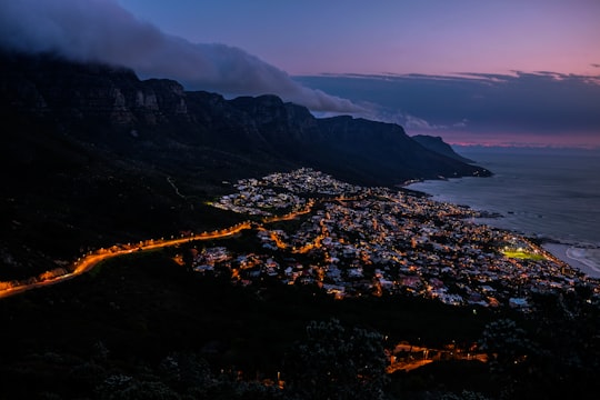 high-angle photography of city near smoky mountain and body of water during sunset in Table Mountain National Park South Africa