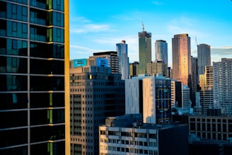 A city skyline blending Indian and Dubai architecture under a bright, hopeful sky.