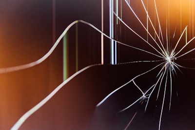 a close up of a broken glass window