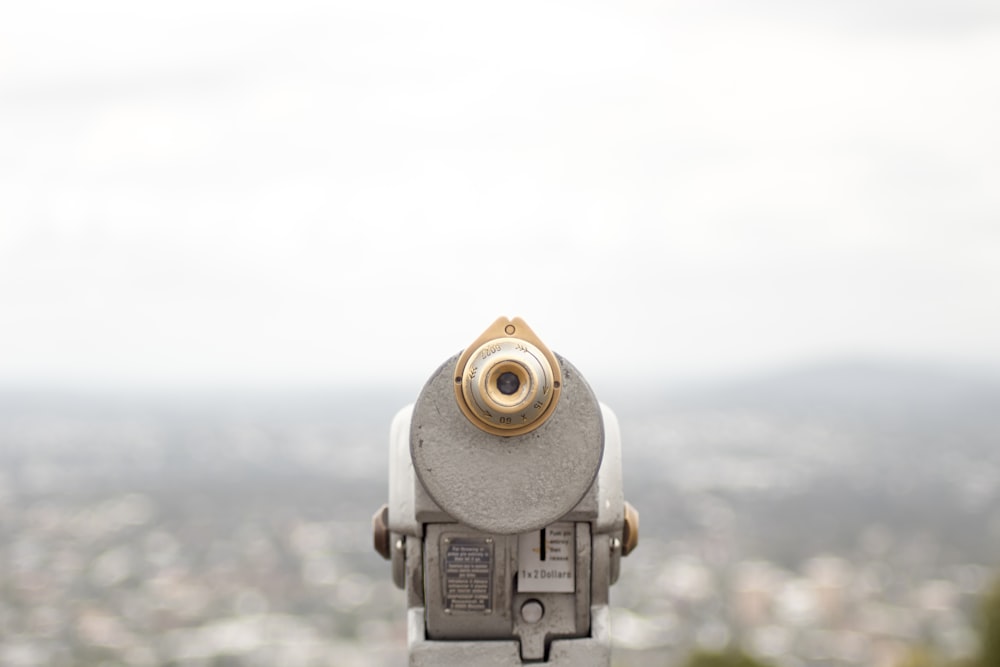 closeup photography of coin operated telescope