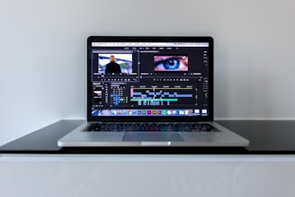 MacBook Pro on black desk