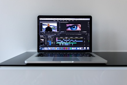 MacBook Pro on black desk