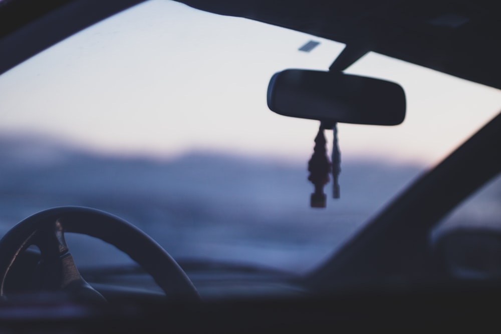 tilt-shift photography of rear view mirror