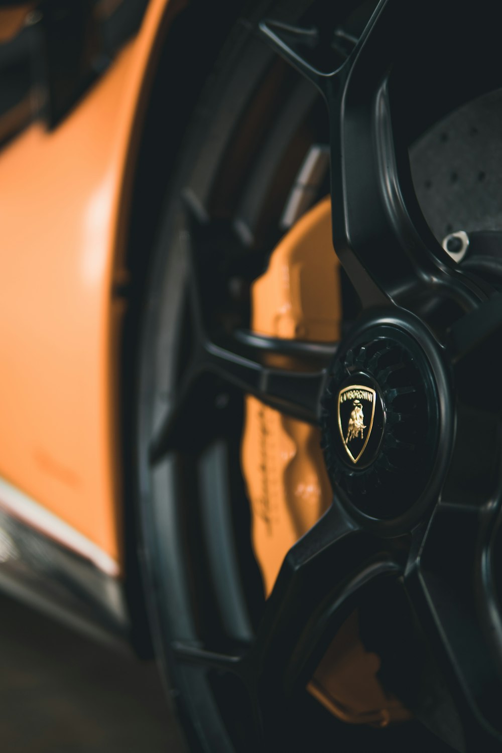 a close up of a wheel on a sports car