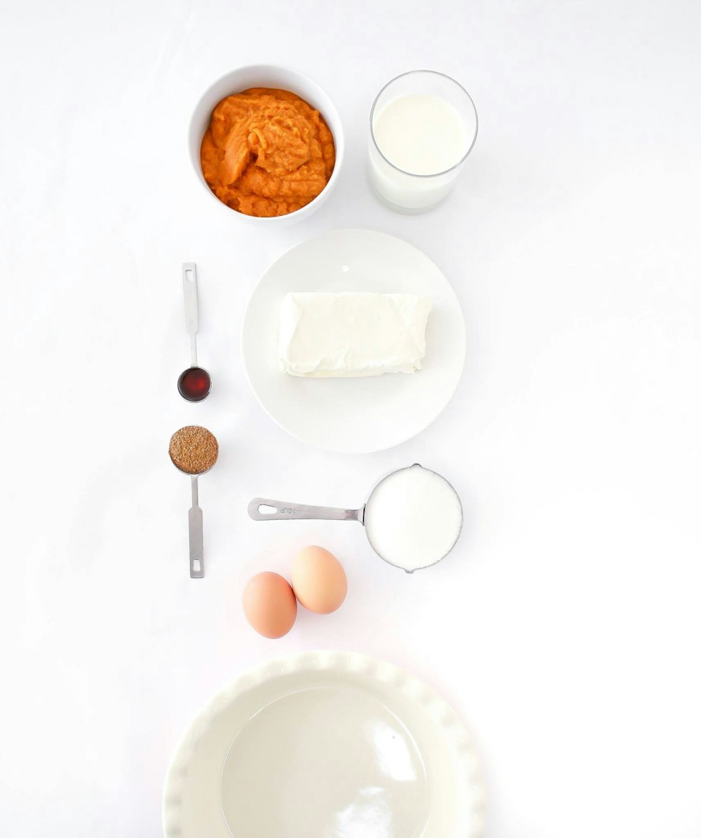 assorted ingredients on white table