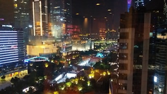 A cinematic night city skyline with glowing university campuses and international students walking confidently under neon lights.