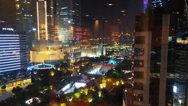 A vibrant AI-generated cityscape at sunset with glowing neon lights.