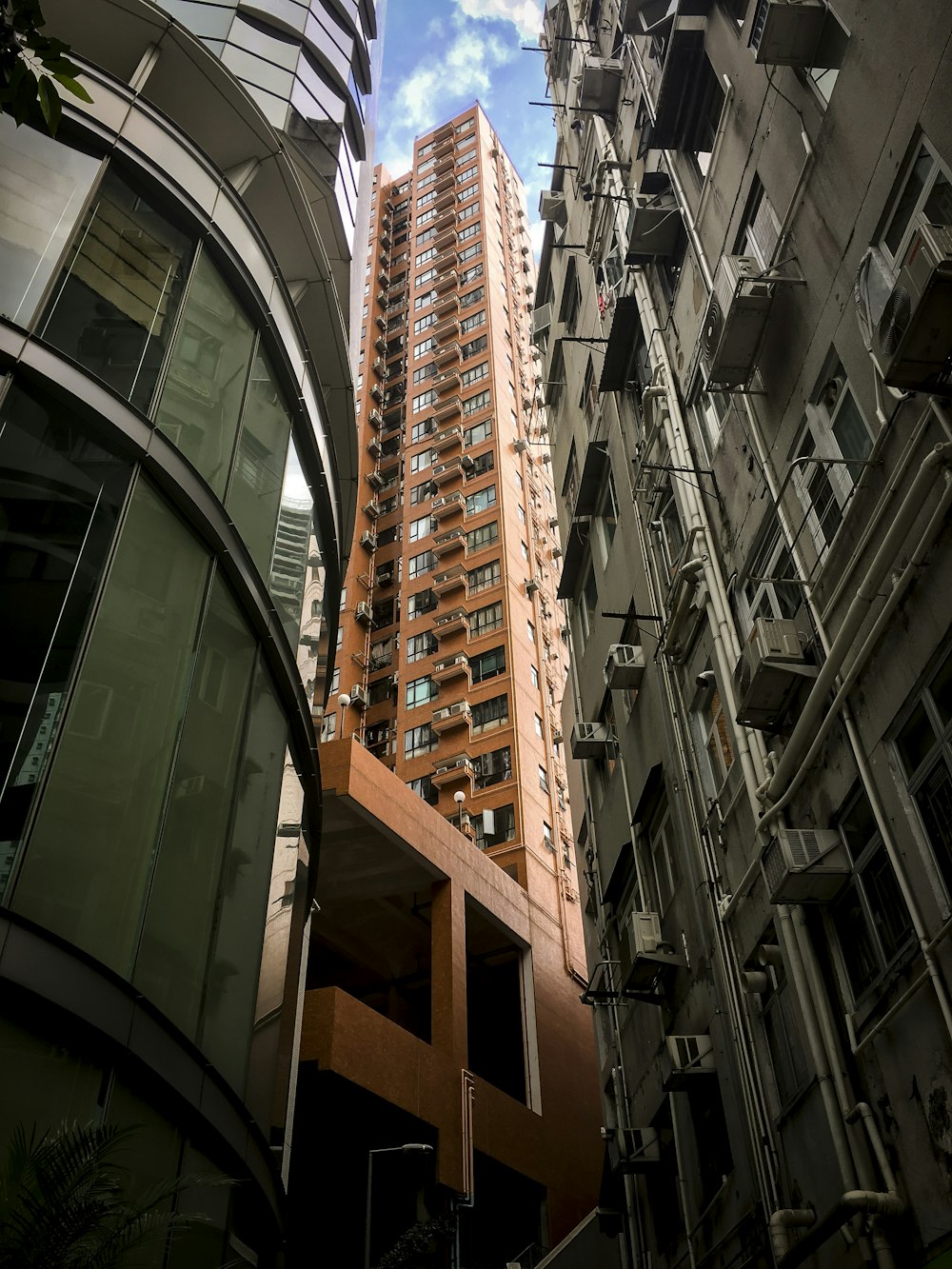 brown high-rise concrete building during daytime