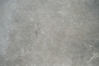 a close up view of a gray marble floor
