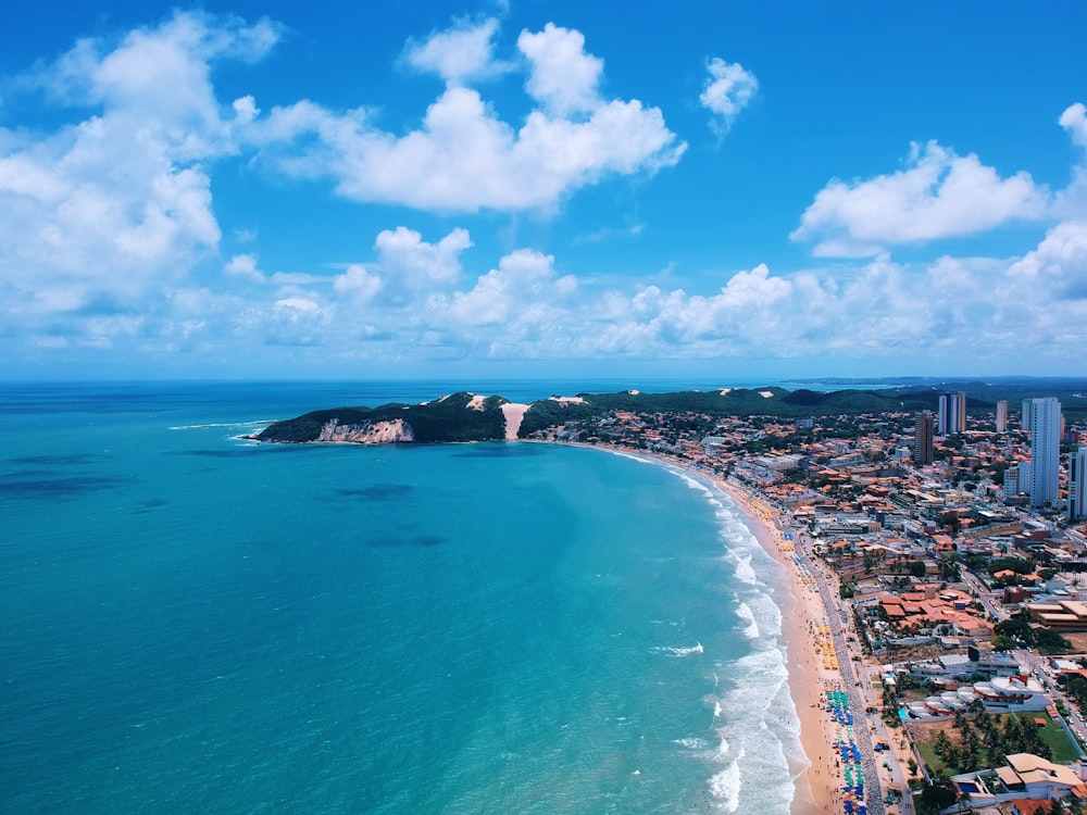 buildings near white sand beach