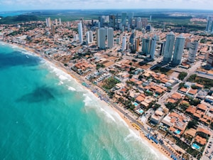 aerial photography of city building near the seashore during daytime