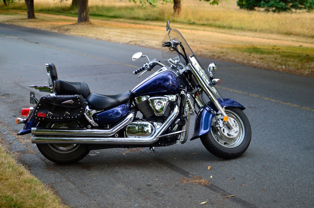 blue and black touring motorcycle on road