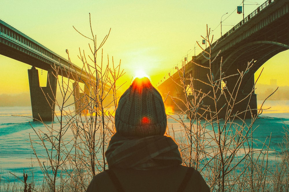 silhouette of person in gray knit cap