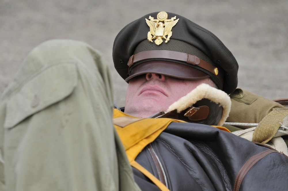 man sleeping with hat on face