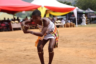 woman performing dance surrounded by people