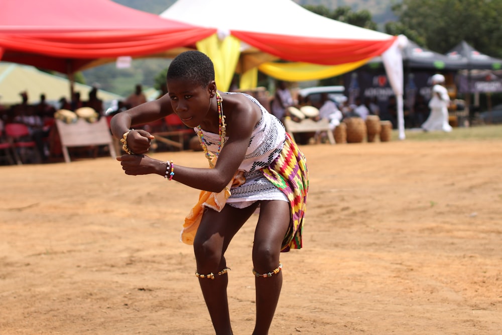 woman performing dance surrounded by people