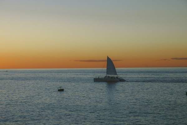 White sailboat at daytime — Cozumel, Mexico