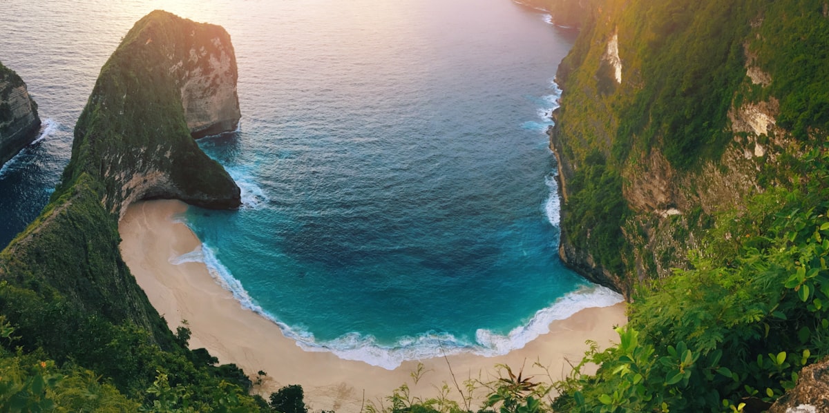 Kelingking Beach Nusa Penida — aerial view of the dramatic T-Rex peninsula and clifftop