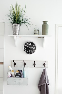 round white analog clock at 3:50